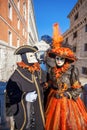 Carnival masks against famous Bridge of Sighs in Venice, Italy Royalty Free Stock Photo