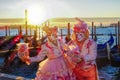 Carnival masks against gondolas in Venice, Italy Royalty Free Stock Photo