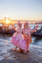 Carnival masks against gondolas in Venice, Italy Royalty Free Stock Photo