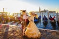 Carnival masks against gondolas in Venice, Italy Royalty Free Stock Photo