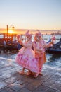 Carnival masks against gondolas in Venice, Italy Royalty Free Stock Photo