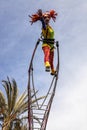 Carnival of Nice, Flowers` battle. An acrobat woman with clown costume on sky background