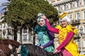 NICE - FRANCE - March 01, 2014: Carnival of Nice, Flowers ` battle. Two english riders in costume greet the audience