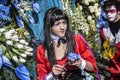 Carnival of Nice, Flowers` battle. Young woman with a blue flower