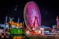 Carnival at night - rides in motion patterned fun lights Royalty Free Stock Photo