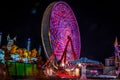 Carnival at night - rides in motion patterned lights Royalty Free Stock Photo