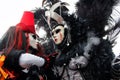 Carnival pair black-red mask and costume at the traditional festival in Venice, Italy