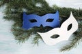 Carnival paper masks on wooden background