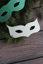 Carnival paper masks on wooden background