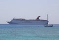 Carnival Paradise Cruise Ship anchors at the Port of George Town, Grand Cayman Royalty Free Stock Photo