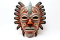 Carnival red mask for the festival. Aztec traditional, ceremonial mask on white background. Warrior mask. Tribal totem