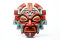 Carnival red mask for festival. Aztec traditional, ceremonial mask on white background. Warrior mask. Tribal totem