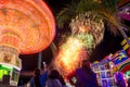 Carnival ride and fireworks at night in the state fair in leon guanajuato mexico with light trails and long exposure Royalty Free Stock Photo