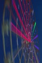 Carnival ride showing a spinning ferris wheel in action Royalty Free Stock Photo