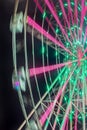 Carnival ride showing a spinning ferris wheel in action Royalty Free Stock Photo