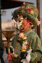 Carnival of Venice 2024 edition - Musician with a lot of flowers and a mask