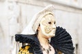 Beautiful mask at St. Mark square during the carnival of Venice