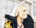 Beautiful mask at St. Mark square during the carnival of Venice