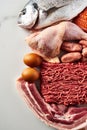 Carnivore diet or low carb diet background concept. Raw animal meat products beef, minced pork and sausages, chicken Royalty Free Stock Photo