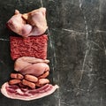 Carnivore diet or low carb diet background concept. Raw animal meat products beef, minced pork and sausages, chicken Royalty Free Stock Photo