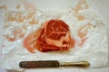 Carnivore, meat diet conceptual image with rib eye steak ready to be cooked on a white background