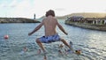 Carnlough New Years Day Swim jumping into sea Royalty Free Stock Photo