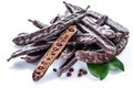 Carob pods and carob powder on the white background. Royalty Free Stock Photo