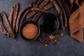 Carob pods, powder and molasses or syrup Royalty Free Stock Photo