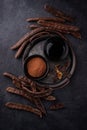 Carob pods, powder and molasses or syrup Royalty Free Stock Photo