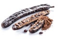 Carob pods and carob powder on the white background Royalty Free Stock Photo