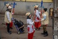 Carolers in traditional costumes walking on the street from Bucharest