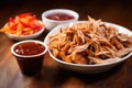 carolina-style pulled pork served with side of secret recipe vinegar sauce