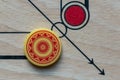 Carom striker on carom board.