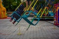 Carousel children`s seats run fast at amusement park Royalty Free Stock Photo