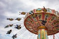 Carousel on cloudy sky background. Oktoberfest, Bavaria, Germany Royalty Free Stock Photo