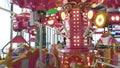 Carousel game machine. With a very cute horse. Colorful and flashing lights.