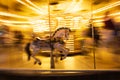 Carousel horse with head in focus and the rest blurred by motion Royalty Free Stock Photo