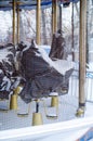 carousel with horses that are wrapped in a cloth under snow Royalty Free Stock Photo