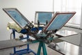 Carousel machine for silk screen printing on T-shirts at work