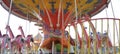 Carousel or A merry-go-round in the form of colorful giraffes and horses during the day Royalty Free Stock Photo