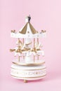 Carousel with miniature bride and groom figures on top