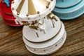 Carousel Music Boxes on Brown Wooden Background