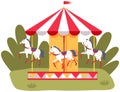Carousel with three colored horses on playground. Outdoor entertainment for children in park Royalty Free Stock Photo