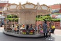 Carousel toy with horses in amusement park for children