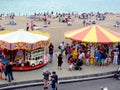 Carousel and vendors on Brighton seashore, Sussex, England