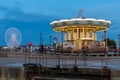 Caroussel and ferris wheel at the harbor of Honfleur