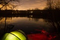 Carp Fishing at Night with illuminated Bivvy Royalty Free Stock Photo