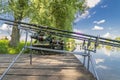 Carp fishing. Rods on rod pod on wood platform at lake Royalty Free Stock Photo