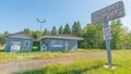 CARP LAKE TOWNSHIP, MICHIGAN / USA - JUNE 16, 2016: Abandoned shut down gas station / convenience store - nature growing back - ru