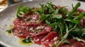 Carpaccio with Arugula and Parmesan on a Ceramic Plate. Close-up food photography
